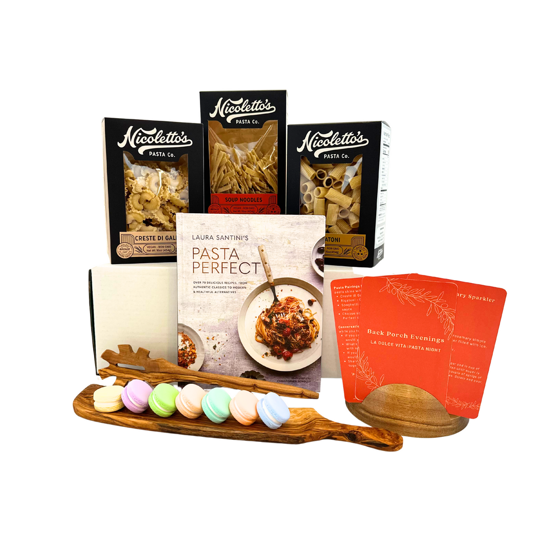 Collection of La Dolce Vita Back Porch Evenings Date Night box including pasta products and cookbooks on a white background